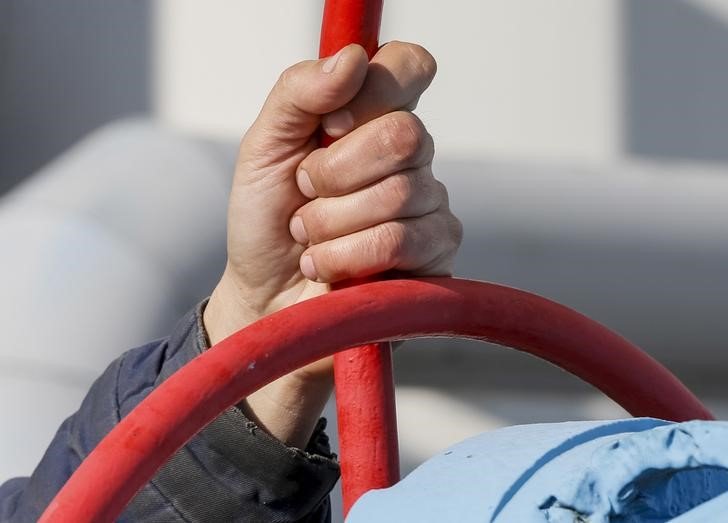 Woodside Energy full-year profit drops 37% as weak prices offset higher sales By Reuters