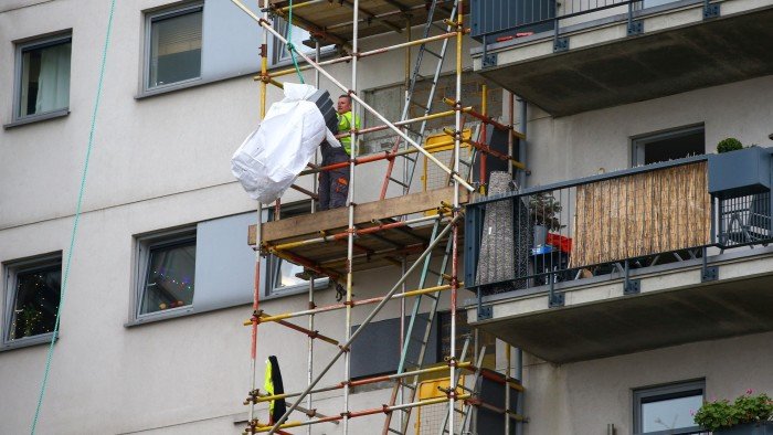 UK government sets new deadline to fix unsafe cladding on residential buildings