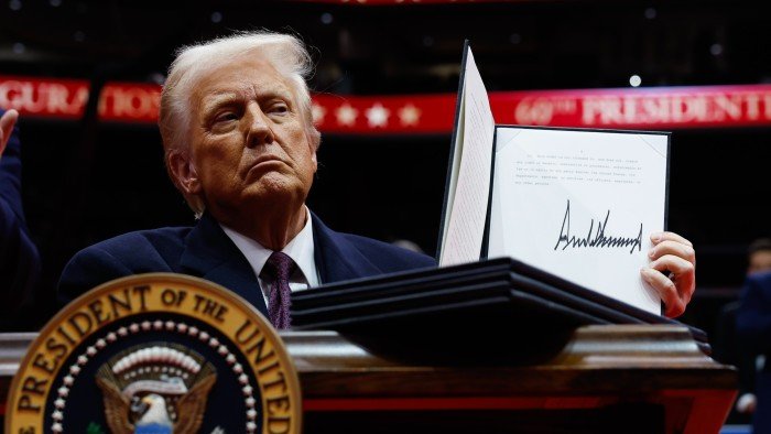 Trump renews tariff threats and signs barrage of orders as he takes power
